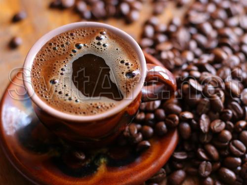A cup of ready-made coffee and grains - F-249i