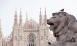 Statue of a lion against the backdrop of a Gothic cathedral - F-284