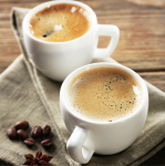 Two cups of coffee on a napkin - F-248a